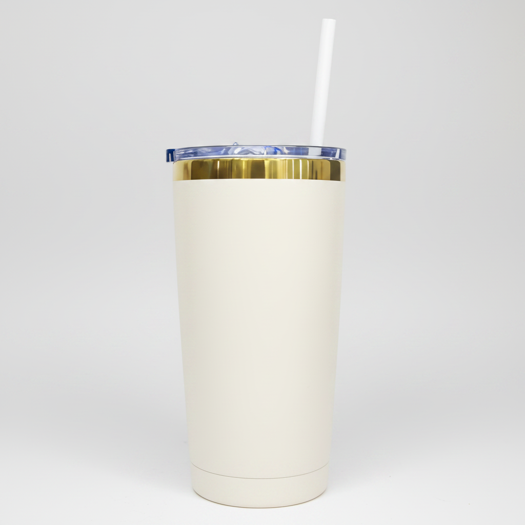 A 20oz mirror gold plated tumbler with a cream color and a white straw.