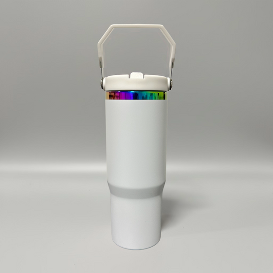 A white insulated travel tumbler with a matching white lid and carry handle, featuring a metallic iridescent rainbow band around the upper portion, set against a neutral gray studio background.