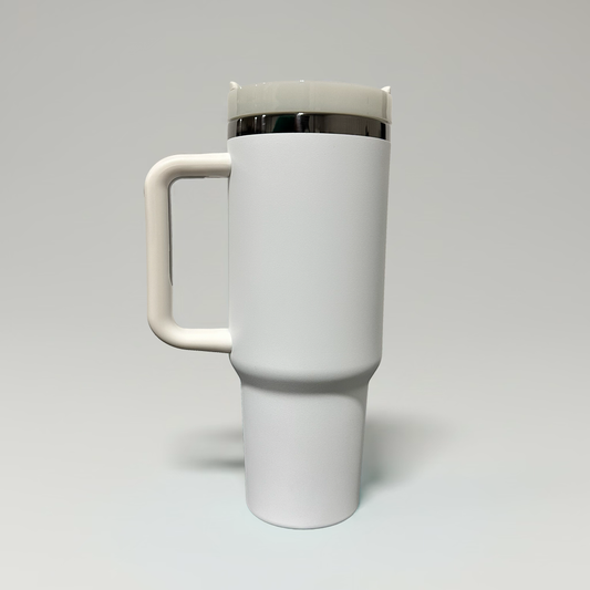 A matte white travel tumbler with a matching handle and lid, featuring a thin metallic silver band around the neck, shown on a neutral light gray background.