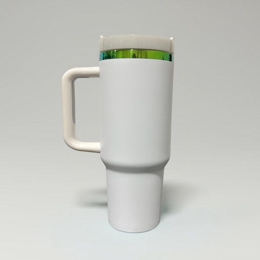 A white travel mug with a matching handle and lid, featuring a thin green metallic band around the upper portion, shown on a neutral light gray background.