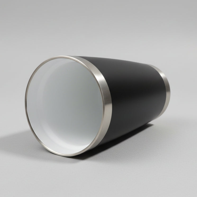 Black tumbler laying on its side looking inside at the ceramic coating